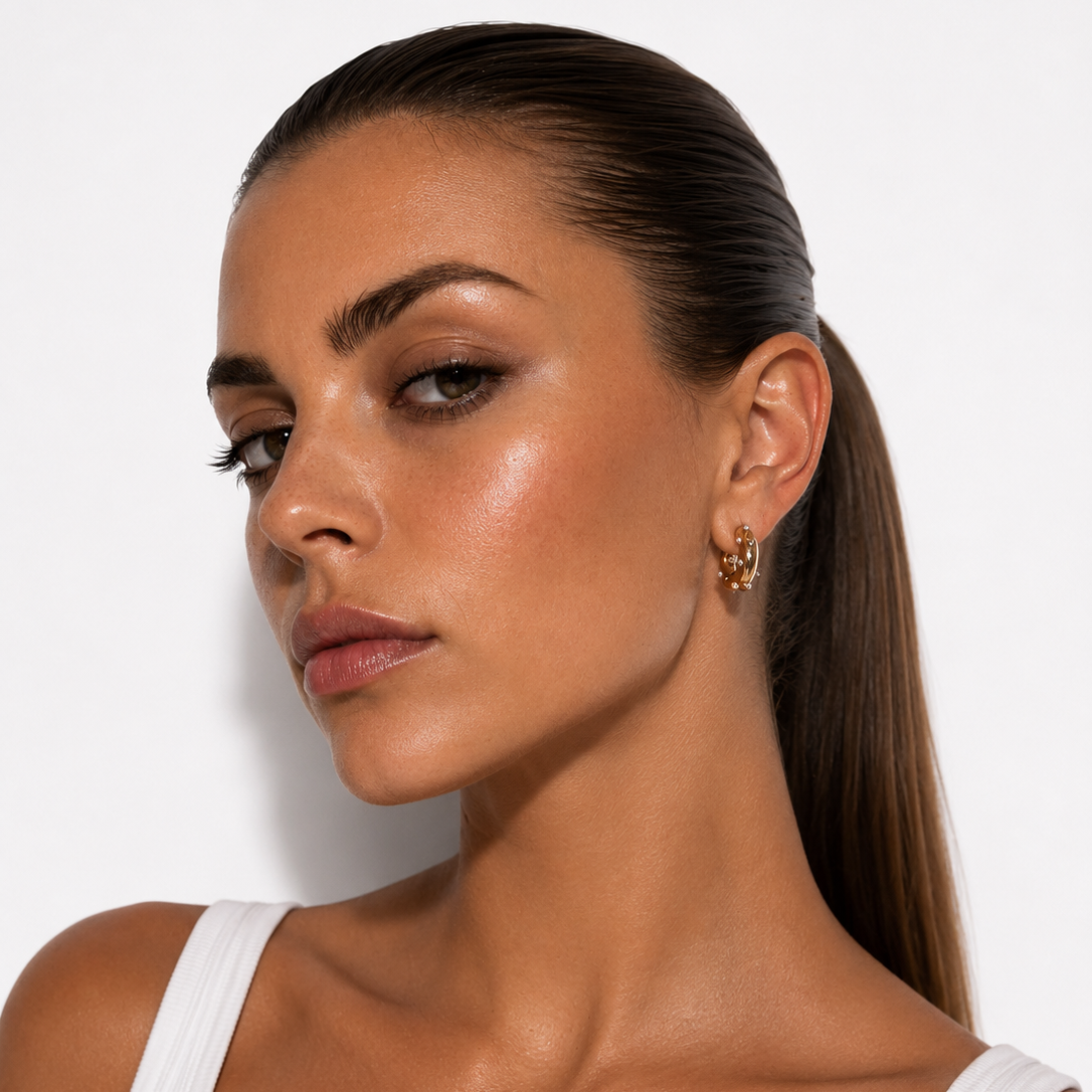 Model wearing Gold Plated Earrings on white background