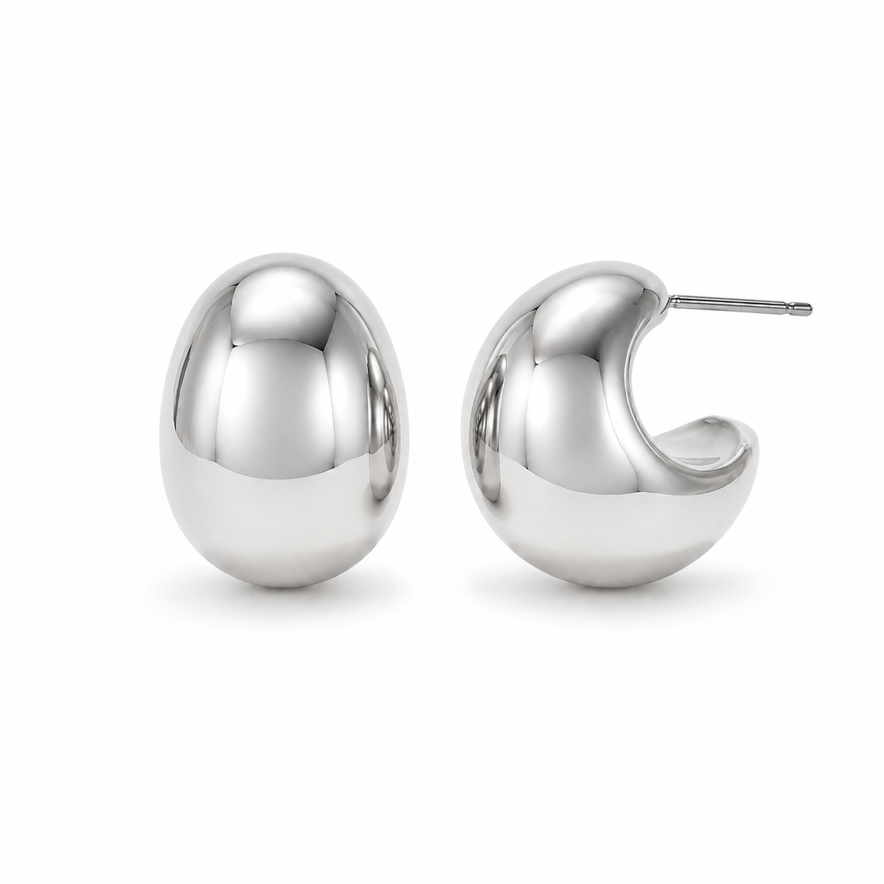 Pair of silver Harper hoop earrings on a white background