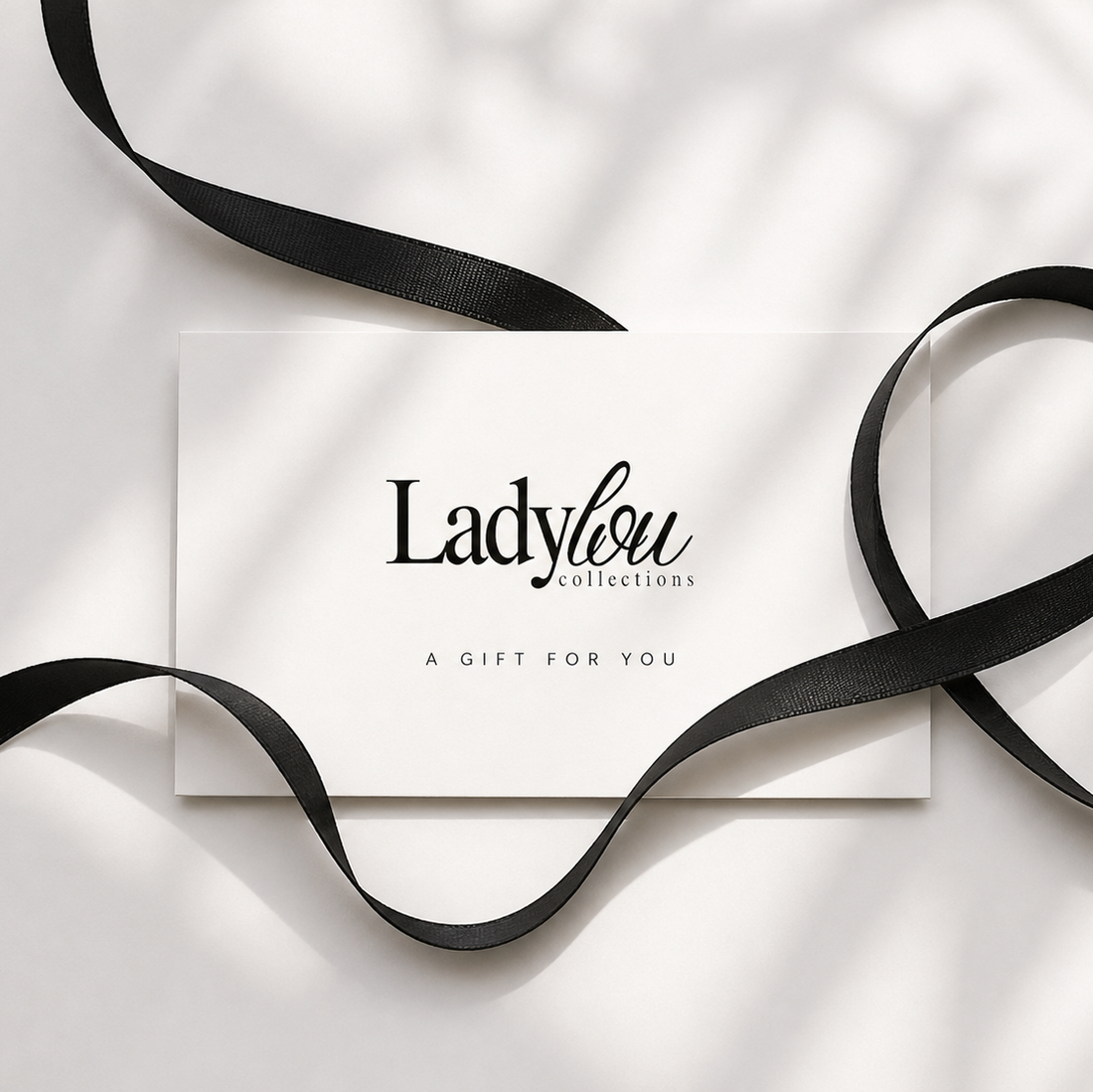 Lady Lou Collections Gift Card on white background and black ribbon