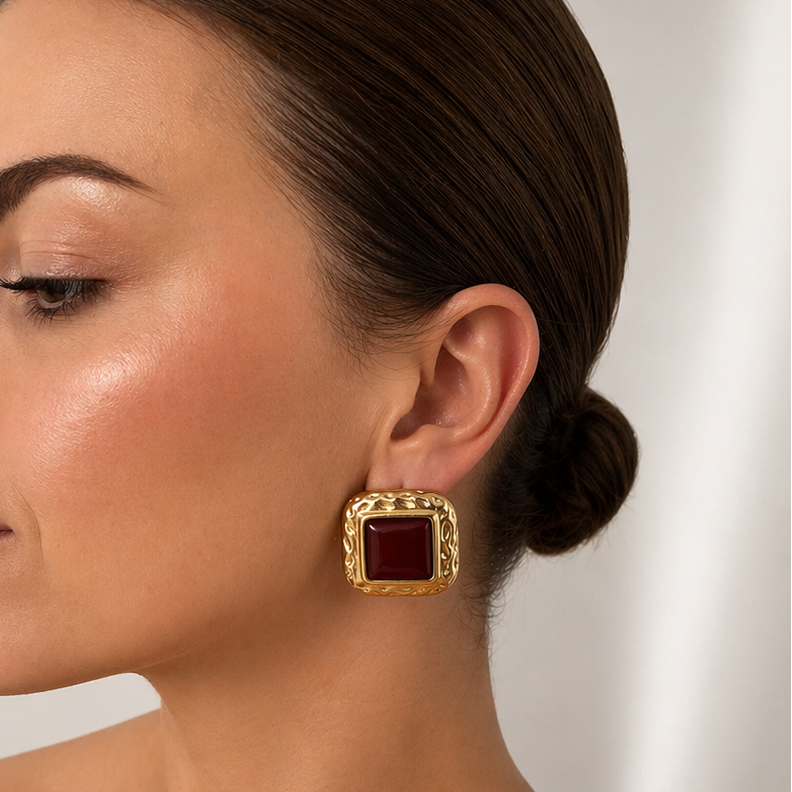 Woman wearing Zara Gold and black stud earrings