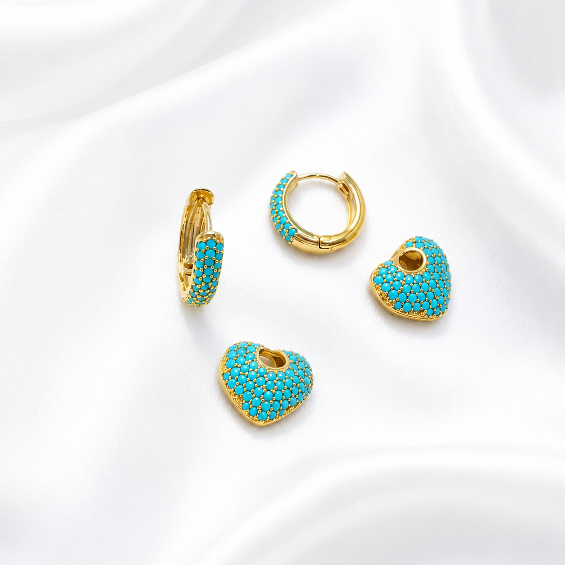 Set of Lady Lou Collections turquoise and gold hoop earrings on a white background