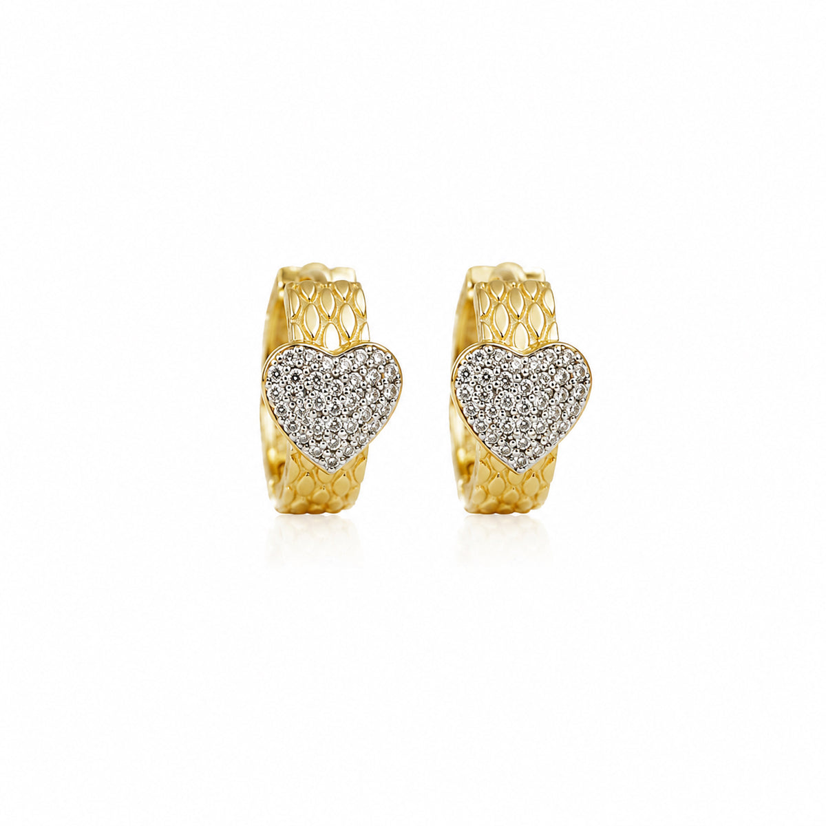 A pair of gold huggie hoop earrings with a textured honeycomb outer band and a central pavé heart-shaped cluster of clear stones, shown on a plain white background.