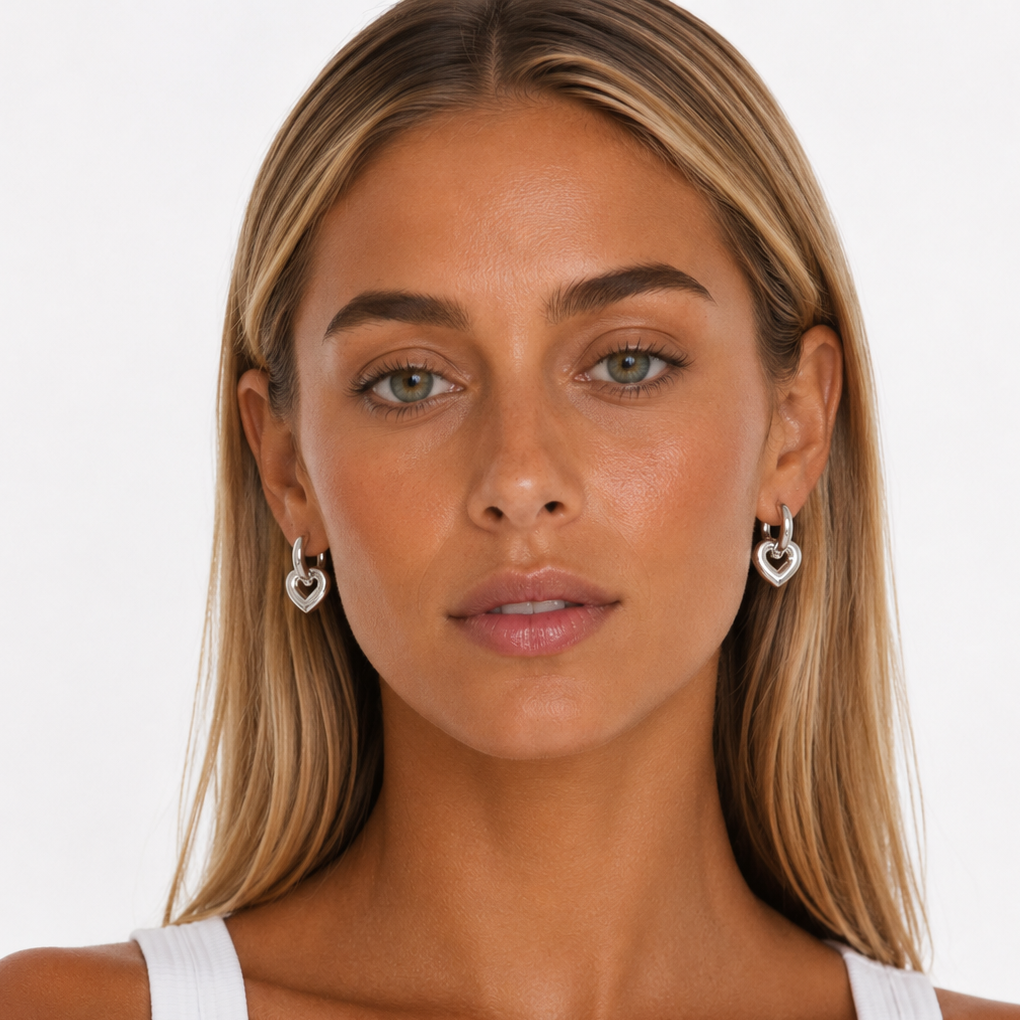 Model wearing Frankie Earrings- Large Gold Silver Huggie Charm Earrings_Lady Lou Collections_On white background