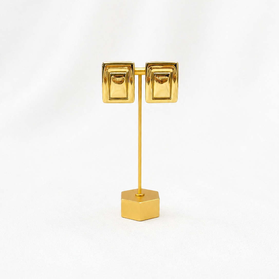 Gold Plated Rectangle earrings on gold stand and white background