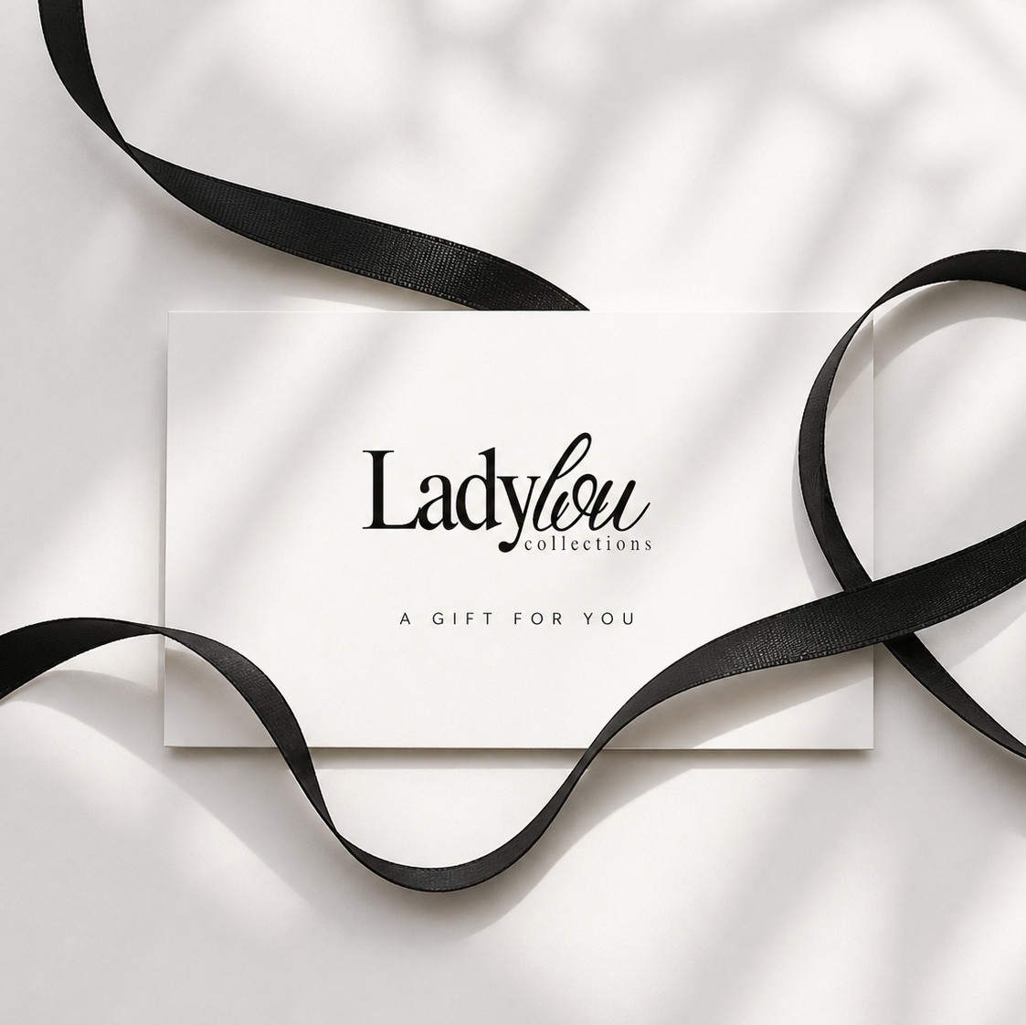 Lady Lou Collections Gift Card on white background and black ribbon
