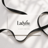 Lady Lou Collections Gift Card on white background and black ribbon