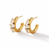 A pair of gold plated crescent-shaped hoop earrings adorned with marquise-cut clear CZ, displayed on a clean white background.