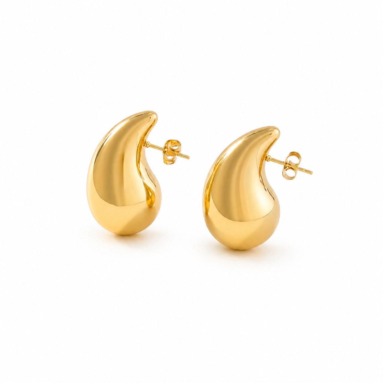 Millie gold statement stud earrings on white background