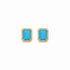 Pair of earrings with blue gemstones and gold frames on a white background