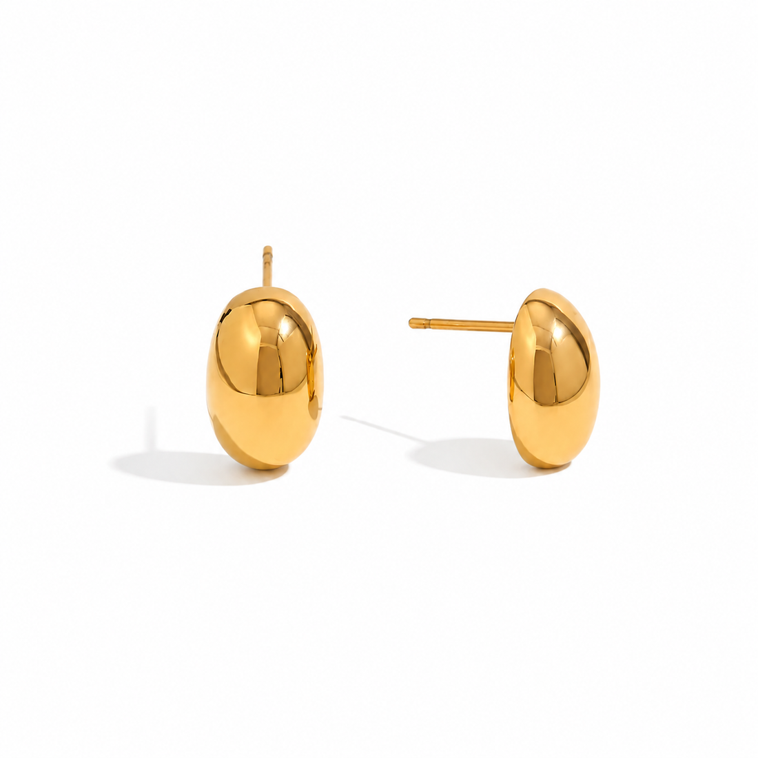 Pair of gold plated earrings on a white background