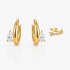 Set of gold earrings with diamond accents on a white background
