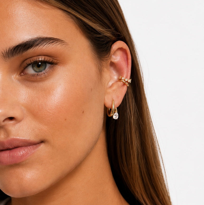 Model wearing the Stevie stack earrings_Earring and cuff. Plain white background